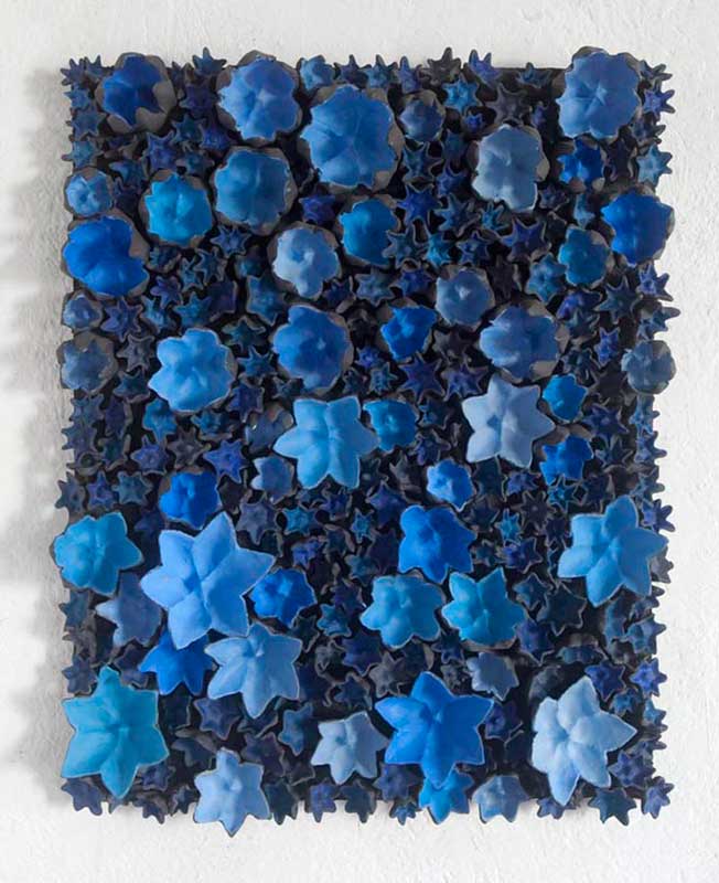 End of the dream 2014, Sculpture by Kazumasa Mizokami, Many large flowers in different shades of blue  which are about to open from the smaller black buds put on a rectangular base panel